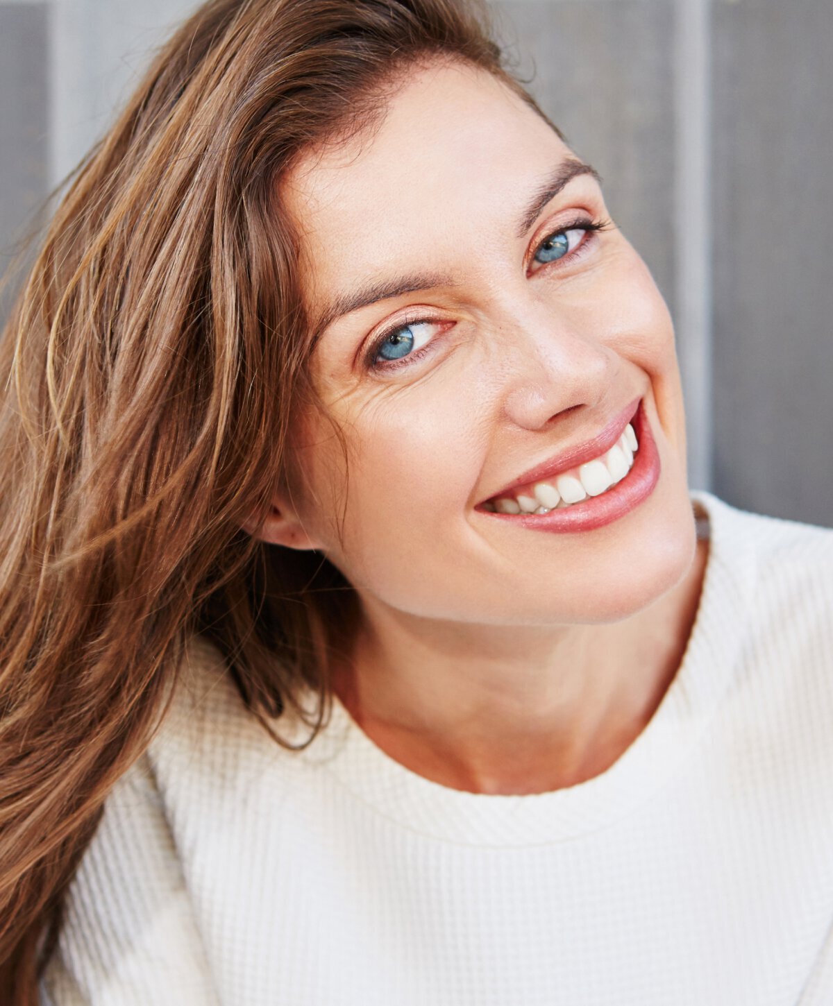 Woman after brow lift smiling