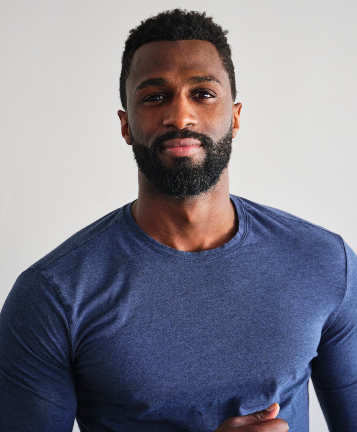 Male plastic surgery model in a blue shirt