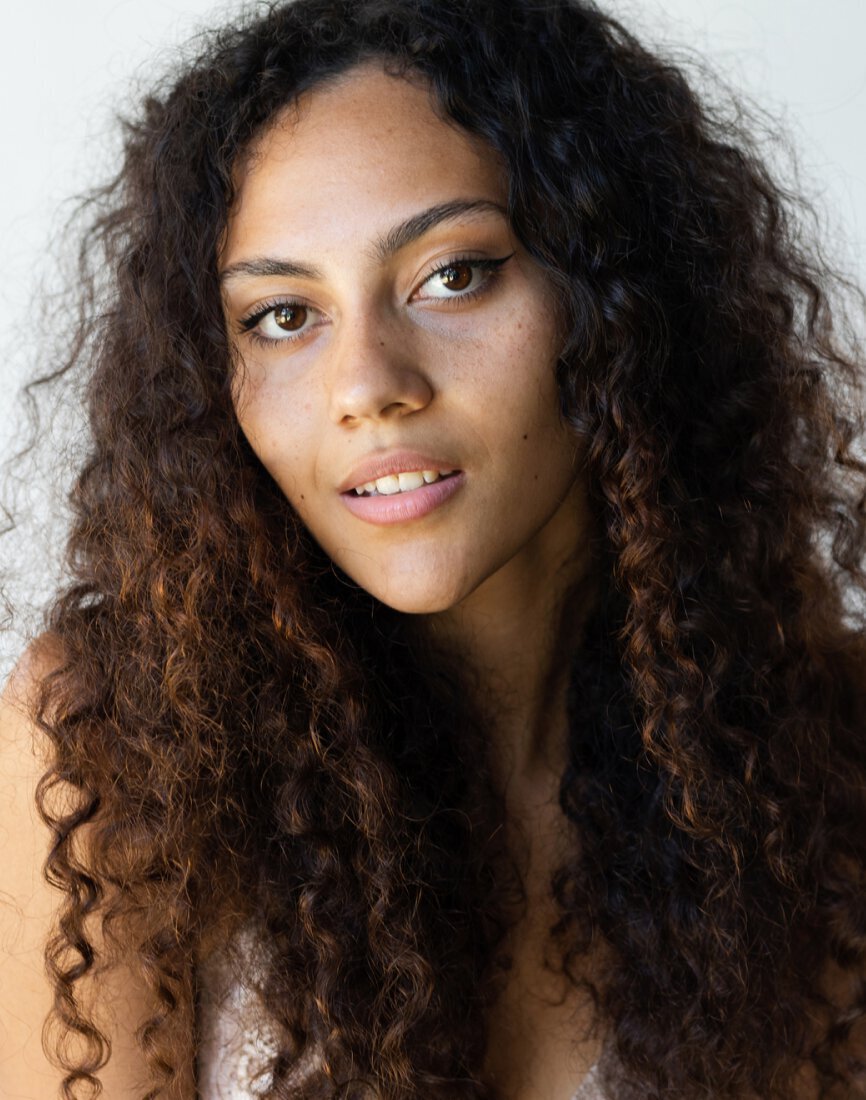 Skin Treatments feature - woman with curly hair