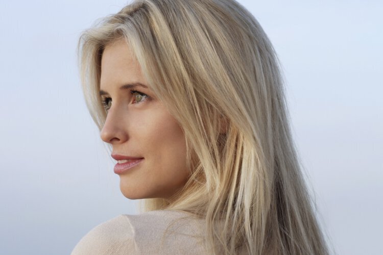 Skin Rejuvenation feature - Blonde woman looking into distance