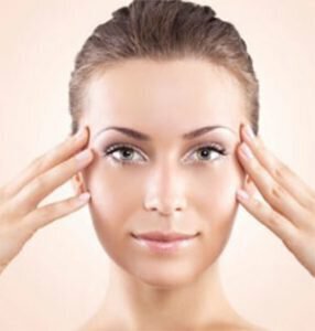 Woman with hands on face