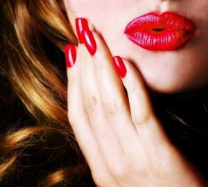 Close up of woman's face, red lips.